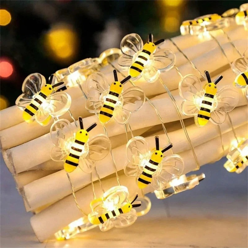 String lights shaped like bees on a blurred background