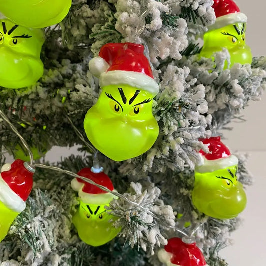 Christmas LED string lights with funny Grinch face design for holiday tree and home decorations