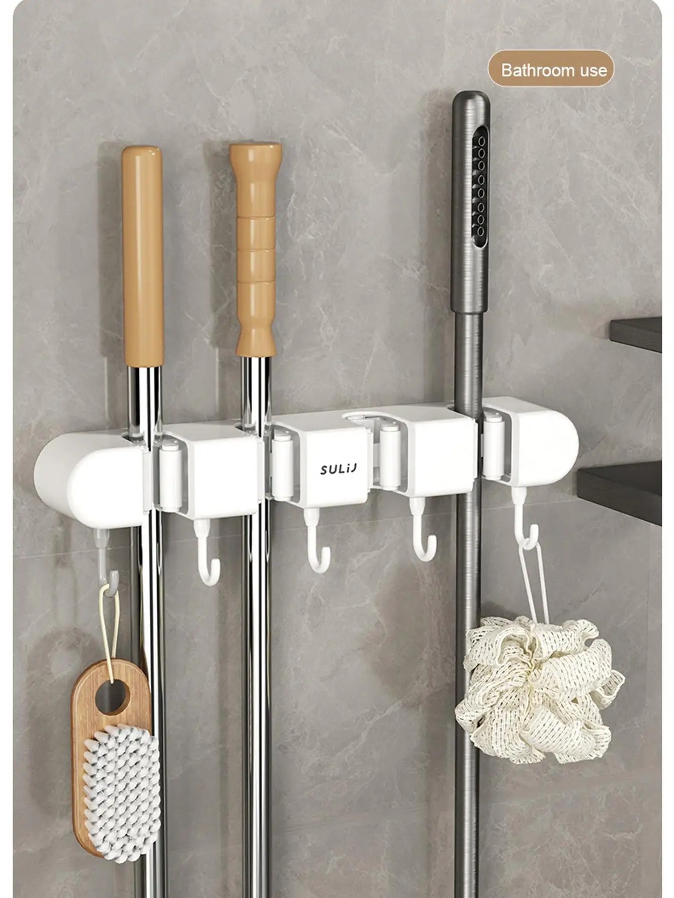 Bathroom hook rack with various items on a tiled wall