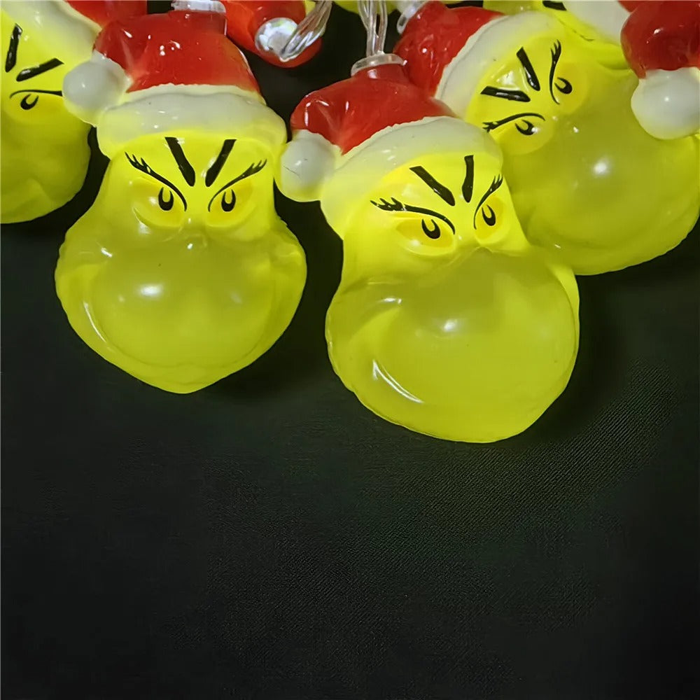 Christmas LED string lights with funny Grinch face design for holiday tree and home decorations