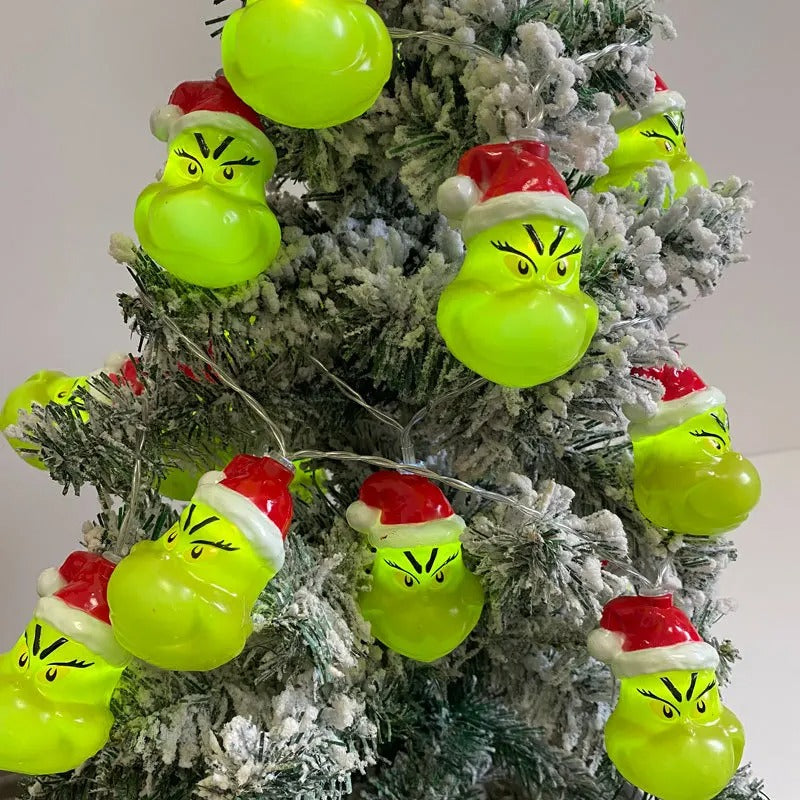 Christmas LED string lights with funny Grinch face design for holiday tree and home decorations