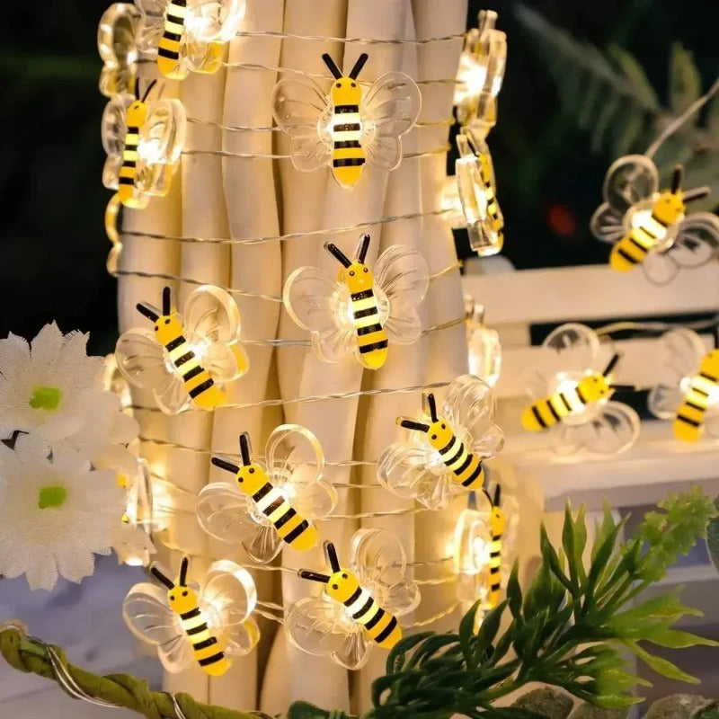 String lights shaped like bees with a blurred background