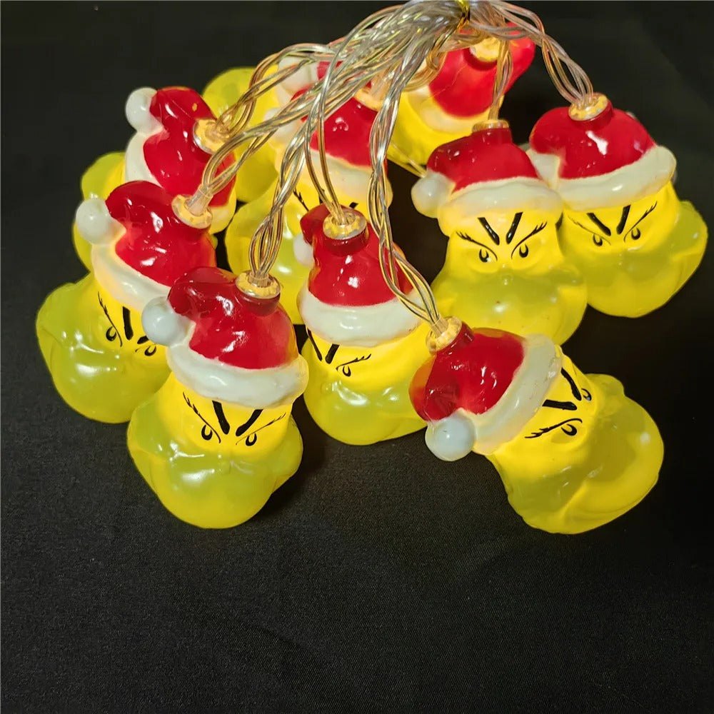 Christmas LED string lights with funny Grinch face design for holiday tree and home decorations

